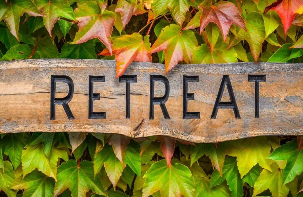 "Retreat" sign with a green background